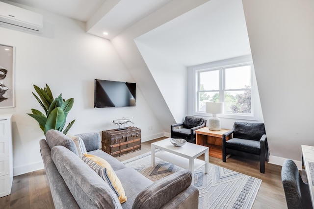 36 Pearl St Unit 3, Provincetown, MA 02657 - living room with a wall mounted AC, wood finished floors, baseboards, and recessed lighting