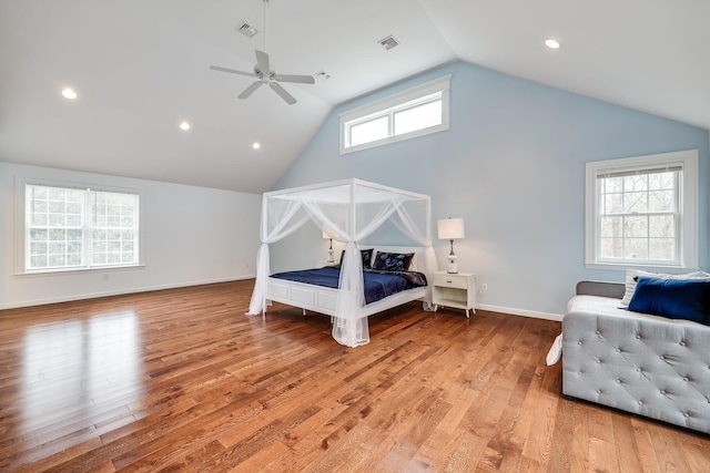 bedroom with light wood-type flooring, ceiling fan, and lofted ceiling