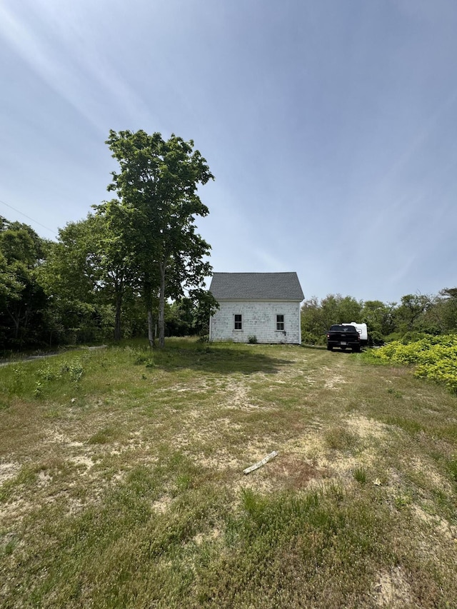 26 Center St, South Dennis, MA 02660 - view of yard featuring a barn and an outbuilding