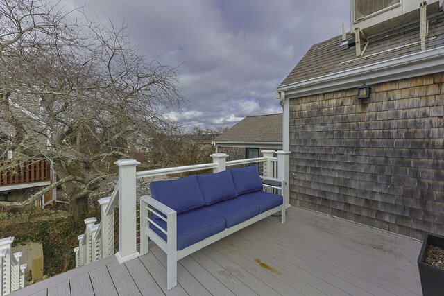 wooden deck featuring an outdoor living space