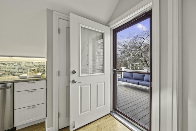 entryway featuring light hardwood / wood-style floors and lofted ceiling