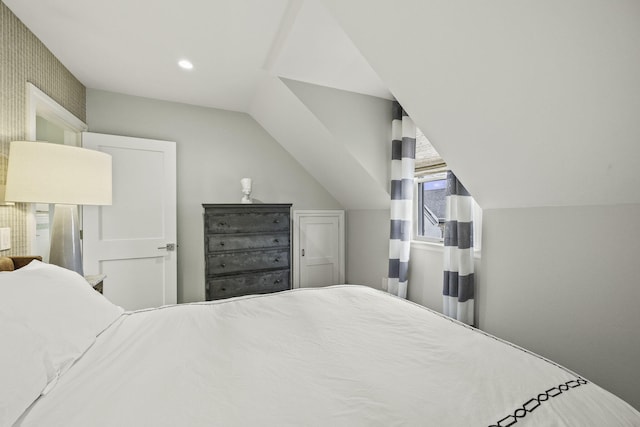 bedroom featuring vaulted ceiling