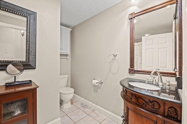 28 Brook St, Plympton, MA 02367 - bathroom with tile patterned flooring, toilet, vanity, baseboards, and a textured ceiling