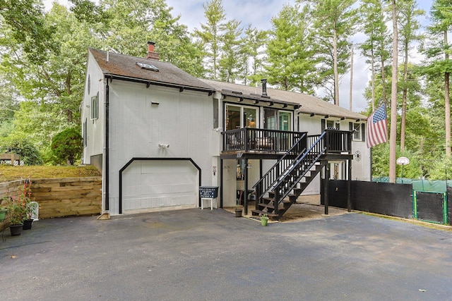 28 Brook St, Plympton, MA 02367 - view of front of property featuring stairs, driveway, a deck, a chimney, and a shingled roof