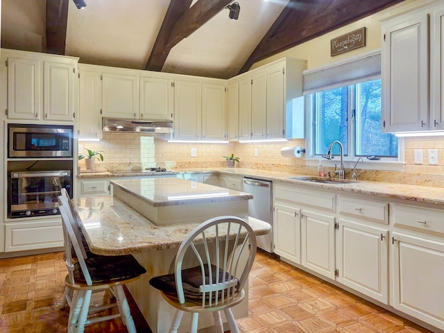 28 Brook St, Plympton, MA 02367 - kitchen with appliances with stainless steel finishes, a sink, a kitchen island, under cabinet range hood, and white cabinetry