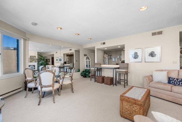 dining space featuring carpet flooring, visible vents, and baseboard heating