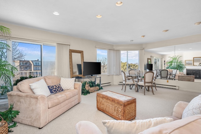 living room with plenty of natural light, carpet, recessed lighting, and baseboard heating