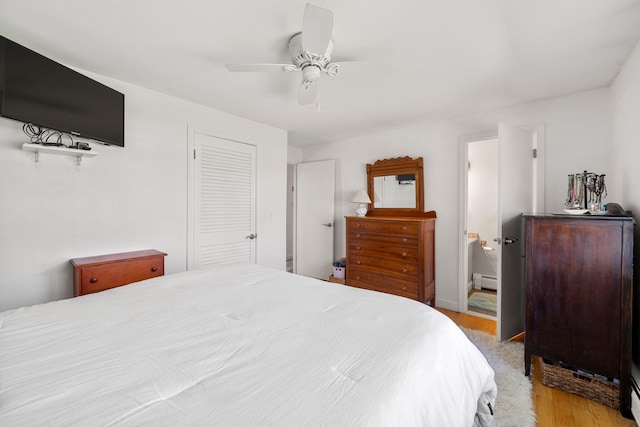 64 Gold Finch Ln, South Dennis, MA 02660 - bedroom featuring light wood-style floors, a ceiling fan, and a baseboard heating unit