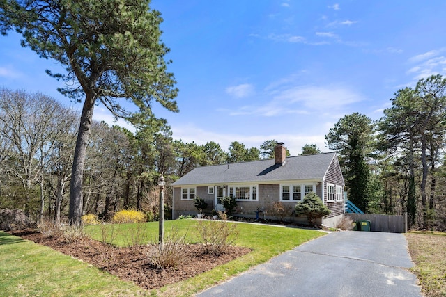64 Gold Finch Ln, South Dennis, MA 02660 - ranch-style home featuring roof with shingles, a front lawn, a chimney, and driveway