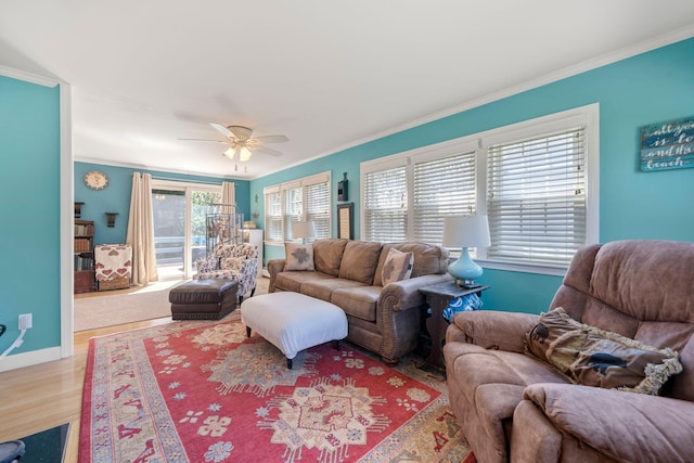 64 Gold Finch Ln, South Dennis, MA 02660 - living room featuring crown molding, wood finished floors, baseboards, and ceiling fan