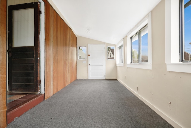 7-9 Crescent Pl, Onset, MA 02558 - unfurnished room featuring vaulted ceiling, carpet flooring, and wooden walls