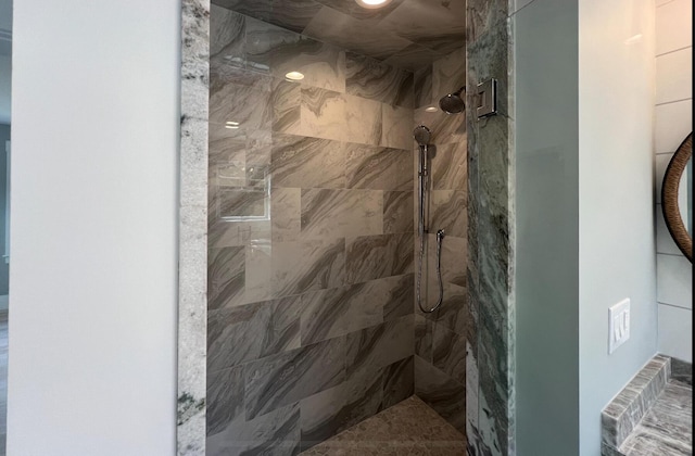 bathroom with a tile shower