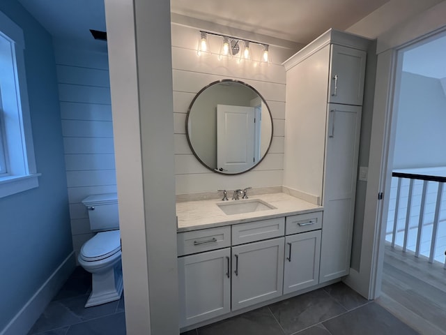 bathroom with tile patterned floors, vanity, and toilet