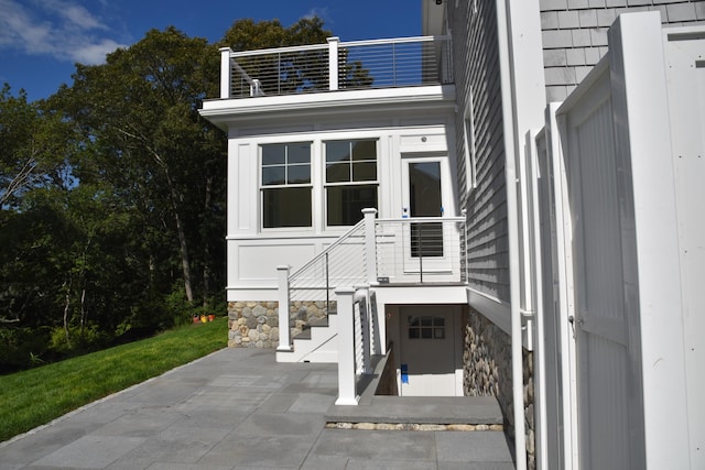 entrance to property with a balcony