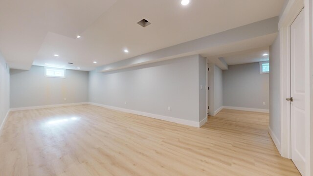 basement featuring light hardwood / wood-style floors