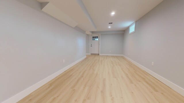 unfurnished room with light hardwood / wood-style floors