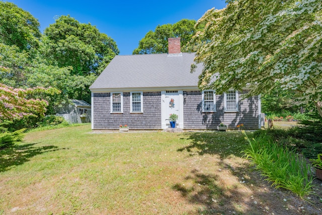 181 Stony Brook Rd, Brewster, MA 02631 - cape cod home featuring a chimney and a front yard