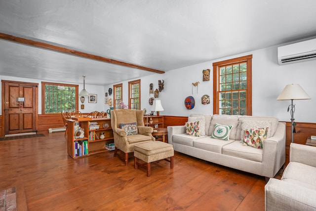 181 Stony Brook Rd, Brewster, MA 02631 - living area featuring a wall mounted air conditioner, wood finished floors, beamed ceiling, and healthy amount of natural light