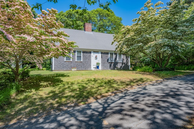 181 Stony Brook Rd, Brewster, MA 02631 - view of front of house with a chimney and a front lawn
