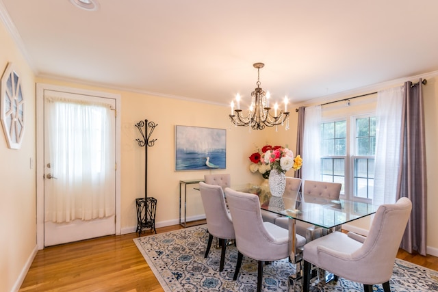 15 Mirror Brook Rd, West Yarmouth, MA 02673 - dining space with a chandelier, ornamental molding, and light wood-style flooring