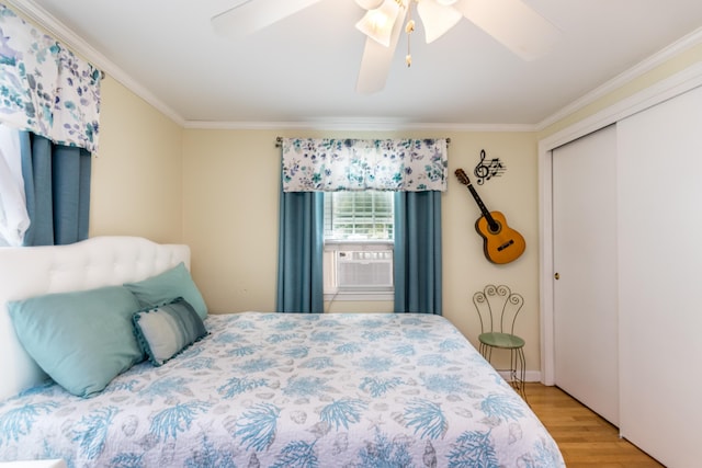 15 Mirror Brook Rd, West Yarmouth, MA 02673 - bedroom with ornamental molding, cooling unit, wood finished floors, a closet, and a ceiling fan