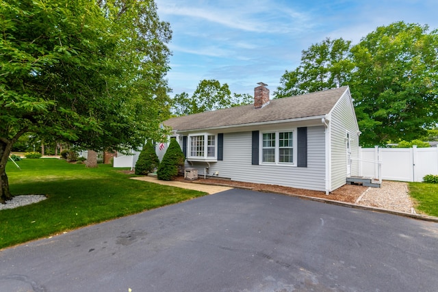 15 Mirror Brook Rd, West Yarmouth, MA 02673 - view of front facade with a chimney and roof with shingles
