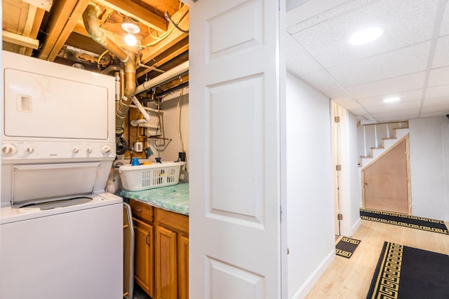 15 Mirror Brook Rd, West Yarmouth, MA 02673 - washroom with stacked washer / dryer, light wood-style flooring, and recessed lighting