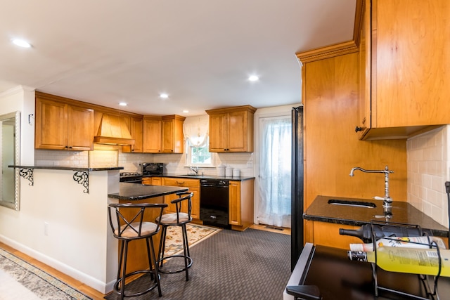 15 Mirror Brook Rd, West Yarmouth, MA 02673 - kitchen featuring black appliances, custom exhaust hood, brown cabinets, backsplash, and recessed lighting