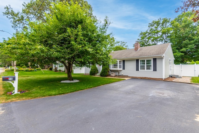 15 Mirror Brook Rd, West Yarmouth, MA 02673 - view of front of property with a chimney and driveway