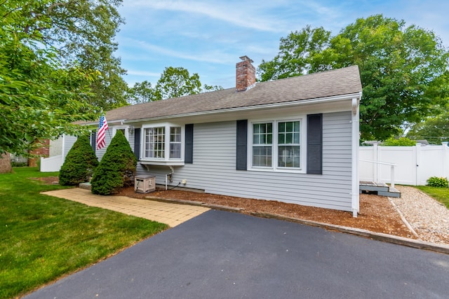 15 Mirror Brook Rd, West Yarmouth, MA 02673 - view of front facade featuring a chimney