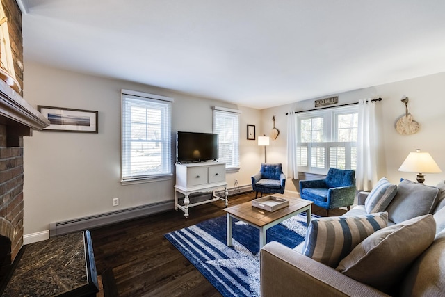 living area with wood finished floors, healthy amount of natural light, a baseboard heating unit, and baseboards