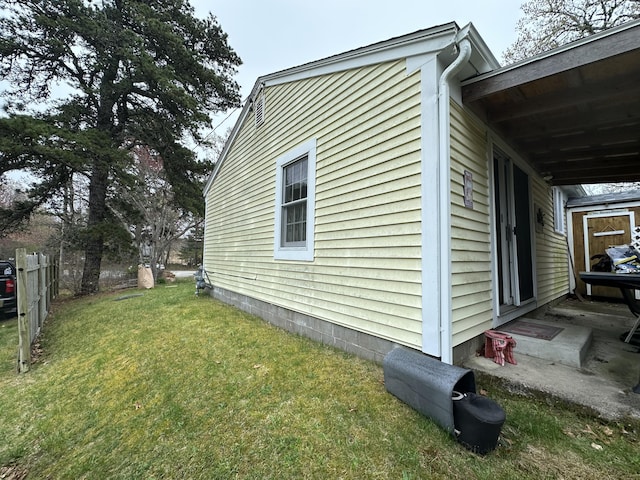 39 Naushon Rd, Dennis Port, MA 02639 - view of side of home with fence and a lawn