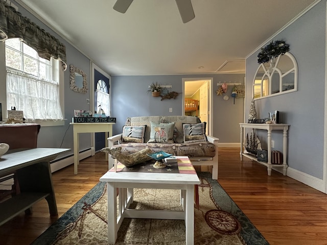 39 Naushon Rd, Dennis Port, MA 02639 - living area with wood finished floors, crown molding, a ceiling fan, baseboard heating, and baseboards
