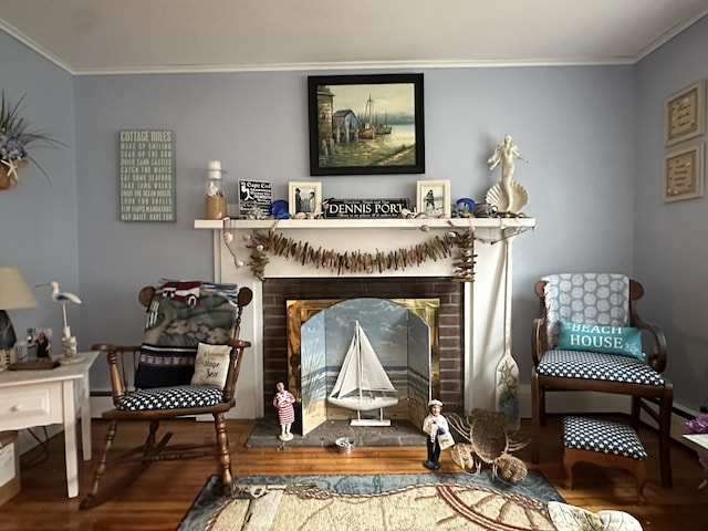 39 Naushon Rd, Dennis Port, MA 02639 - living area with ornamental molding, a fireplace, and wood finished floors