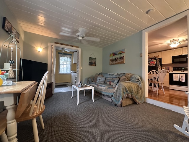 39 Naushon Rd, Dennis Port, MA 02639 - carpeted living room with baseboard heating and ceiling fan