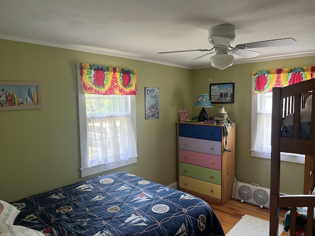 39 Naushon Rd, Dennis Port, MA 02639 - bedroom with wood finished floors, baseboards, crown molding, and a ceiling fan