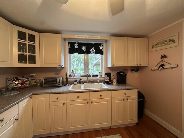 39 Naushon Rd, Dennis Port, MA 02639 - kitchen featuring a sink, wood finished floors, a toaster, glass insert cabinets, and white cabinets