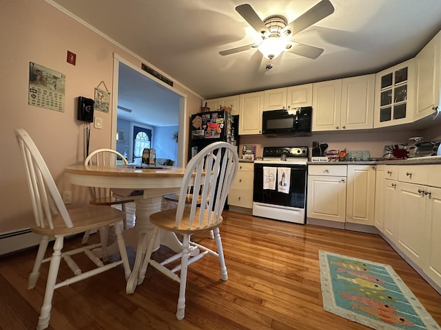39 Naushon Rd, Dennis Port, MA 02639 - kitchen featuring glass insert cabinets, wood finished floors, a ceiling fan, range with electric cooktop, and black microwave