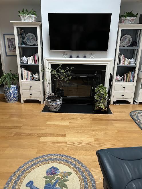 3 Executive Dr, Mashpee, MA 02649 - living area with wood finished floors and a fireplace with flush hearth