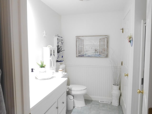 3 Executive Dr, Mashpee, MA 02649 - bathroom featuring vanity, tile patterned floors, and wainscoting