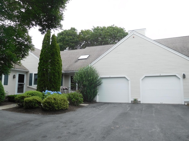 3 Executive Dr, Mashpee, MA 02649 - view of front facade featuring driveway, a shingled roof, and a garage
