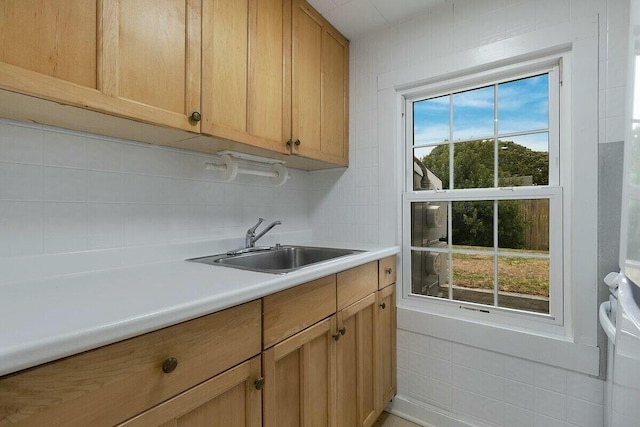 kitchen with sink and decorative backsplash