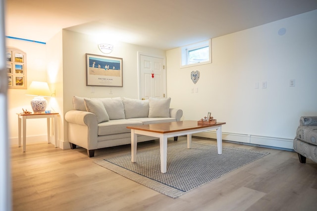625 Bridge Rd, Eastham, MA 02642 - living room with light wood-style flooring and a baseboard heating unit