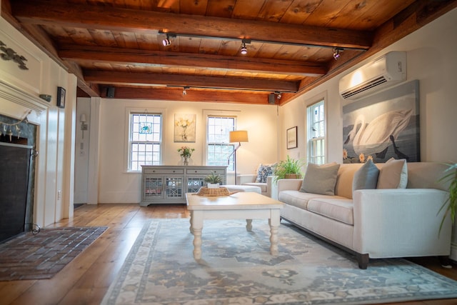 625 Bridge Rd, Eastham, MA 02642 - living area with an AC wall unit, a wood ceiling with exposed beams, and hardwood / wood-style floors