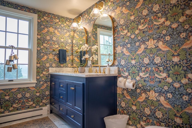 625 Bridge Rd, Eastham, MA 02642 - bathroom with baseboard heating, wallpapered walls, and vanity