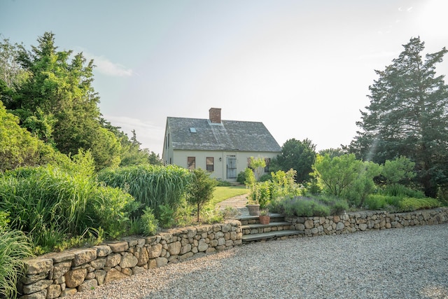 625 Bridge Rd, Eastham, MA 02642 - rear view of house with a chimney