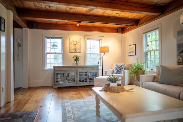 625 Bridge Rd, Eastham, MA 02642 - living area with a wooden ceiling with exposed beams, plenty of natural light, and wood-type flooring