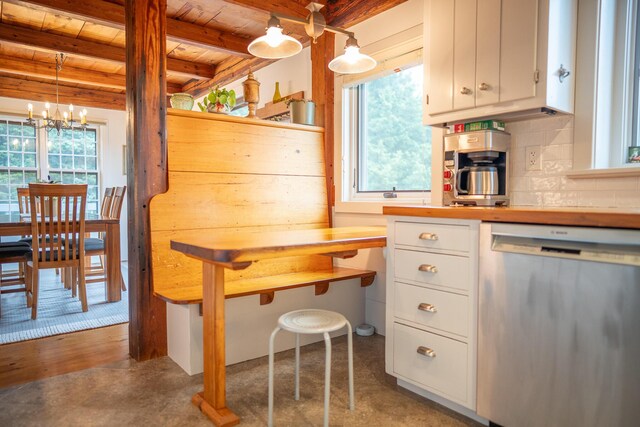 625 Bridge Rd, Eastham, MA 02642 - kitchen with dishwasher, a wooden ceiling with exposed beams, a chandelier, tasteful backsplash, and white cabinetry