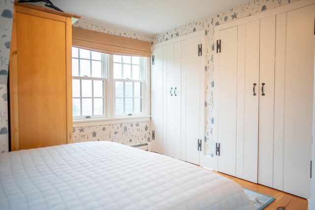 625 Bridge Rd, Eastham, MA 02642 - bedroom with multiple windows, wallpapered walls, and two closets
