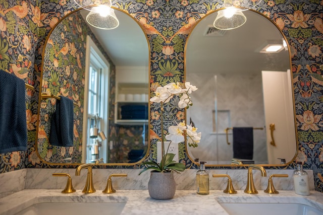 625 Bridge Rd, Eastham, MA 02642 - bathroom featuring wallpapered walls and double vanity